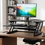 Height-adjustable riser desk converting a regular desk into a standing workstation